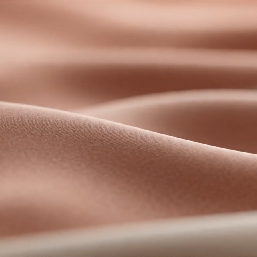 Close-up of sewing work in a warm tailoring studio